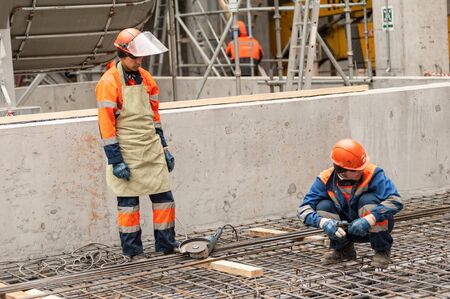 Tobolsk, Russia - May 29. 2018: Sibur company. Construction of plant on processing of hydrocarbons. Workers making foundationのeditorial素材