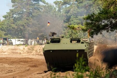 Tyumen, Russia - August 4, 2017: International Army Games. Engineering Formula contest. Speed driving of tracked amphibious carrier PTSのeditorial素材