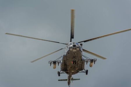 Tyumen, Russia - June 21, 2017: Army Games. Safe Route contest. Military helicopter MI-8 in the cloudy skyのeditorial素材