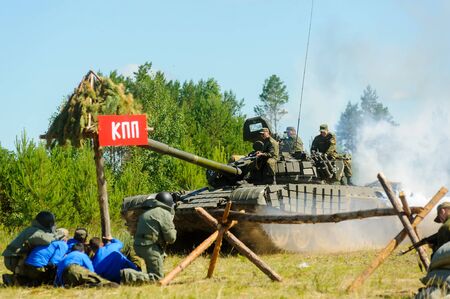Tyumen, Russia - July 1, 2017: Race of Heroes project on the ground of the highest military and engineering school. Show of special troops warriors with tankのeditorial素材