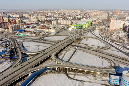 Tyumen, Russia - March 11, 2016: Bird eye view onto road intersection over railwaysのeditorial素材
