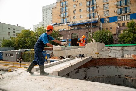Tyumen, Russia - July 31, 2013: JSC Mostostroy-11. Construction of a 18-storeyed brick residental...