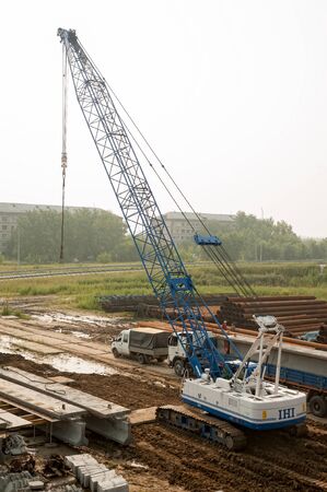 Tyumen, Russia - July 31, 2013: JSC Mostostroy-11. Bridge construction for outcome of the Tobolsk...