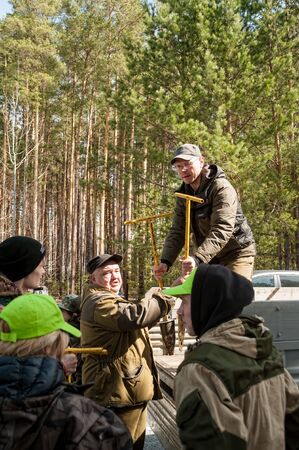 Taraskul, Russia - May 24, 2018: Action of restoration of the wood. People put saplings on the fringe of the forestのeditorial素材