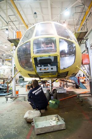 Tyumen, Russia - June 5, 2019: Aircraft repair helicopter UTair Engineering plant. Mi-8 helicopter during maintencance and repair at the service hangarのeditorial素材