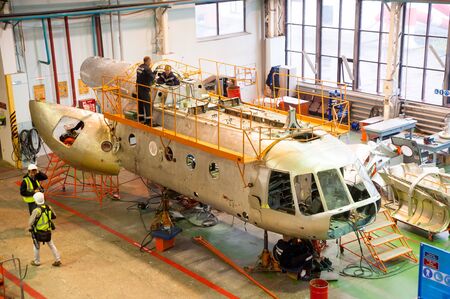 Tyumen, Russia - June 5, 2019: Aircraft repair helicopter UTair Engineering plant. Mi-8 helicopter during maintencance and repair at the service hangarのeditorial素材