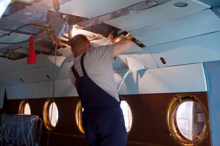 Tyumen, Russia - June 5, 2019: Aircraft repair helicopter UTair Engineering plant. Worker...