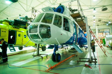 Tyumen, Russia - June 5, 2019: Aircraft repair helicopter UTair Engineering plant. Mi-8 helicopter during maintencance and repair at the service hangarのeditorial素材