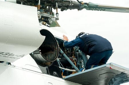 Tyumen, Russia - June 19, 2019: Aircraft repair helicopter UTair Engineering plant. Male mechanic in...