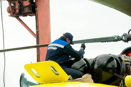 Tyumen, Russia - June 19, 2019: Aircraft repair helicopter UTair Engineering plant. Male mechanic in...