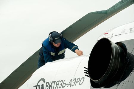 Tyumen, Russia - June 19, 2019: Aircraft repair helicopter UTair Engineering plant. Male mechanic in...