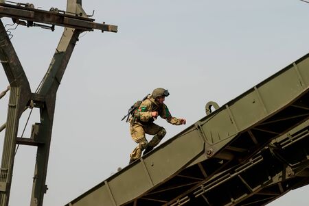 Tyumen, Russia - August 11, 2019: International Army Games. Safe Route contest. Assemblage of the mechanized bridge from TMM setのeditorial素材