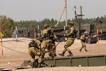 Tyumen, Russia - August 11, 2019: International Army Games. Safe Route contest. Assemblage of the mechanized bridge from TMM setのeditorial素材