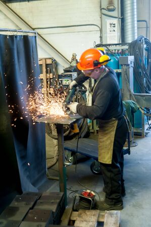 Tyumen, Russia - November 30, 2017: Man in workshop manufacturing metal in Mostootryad-36 Factory
