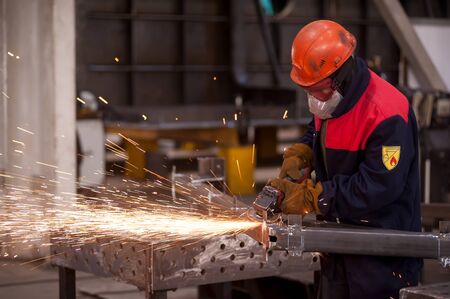 Tyumen, Russia - September 4, 2019: Man in workshop manufacturing metal in Mostootryad-36 Factoryのeditorial素材