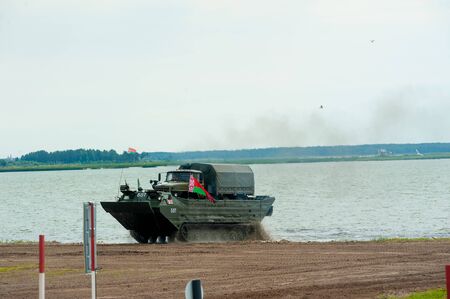 Tyumen, Russia - August 10, 2019: International Army Games. Engineering Formula contest. Equipment transportation across a water obstacle tracked amphibious carrier PTSのeditorial素材
