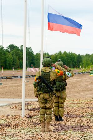 Tyumen, Russia - August 4, 2017: Stage of ARMY-2017 the international army games in Engineering Formula nomination among the units of the engineering troops. Raising the flag ceremonyのeditorial素材