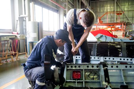Tyumen, Russia - June 5, 2019: Aircraft repair helicopter UTair Engineering plant. Workers...