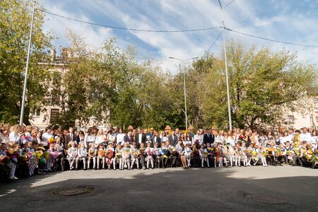 Tyumen, Russia - September 1, 2017: Gymnasium number 5. Primary school children with actor on the first day of the school year. Feast Day of Knowledge.のeditorial素材