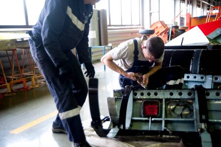 Tyumen, Russia - June 5, 2019: Aircraft repair helicopter UTair Engineering plant. Workers...