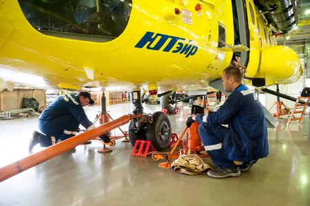 Tyumen, Russia - June 19, 2019: Aircraft repair helicopter UTair Engineering plant. Workers...