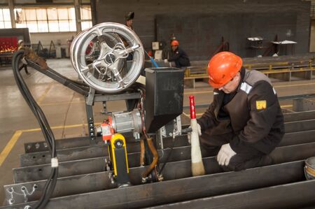 Tyumen, Russia - September 4, 2019: Worker with welder machine in Mostootryad-36 Factory