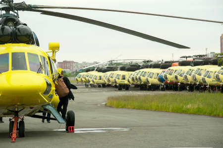 Tyumen, Russia - June 19, 2019: Aircraft repair helicopter UTair Engineering plant. Pilot leaves...