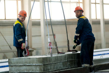 Tyumen, Russia - September 4, 2019: Workshop of Mostootryad-36 Factory. Workers in helmet manage construction processのeditorial素材