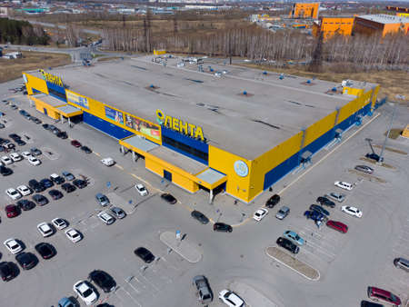 Tyumen, Russia - May 1, 2021: Lenta Shopping Center with a large parking area