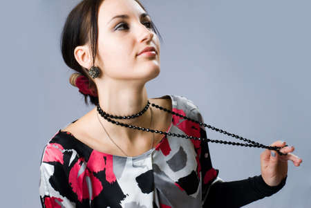 Young pretty woman with beadsの写真素材