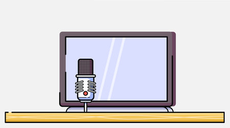 Laptop placed on a desk with an external podcast microphone beside it, ideal for recording,...