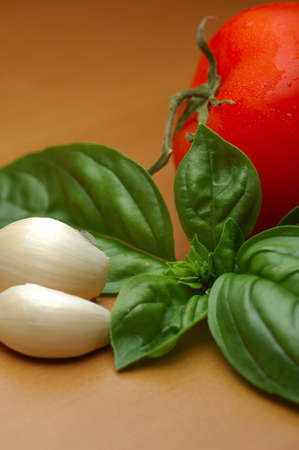 Closeup of basilico, tomato and garlic ingredientsの写真素材