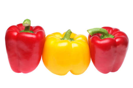 Red and yellow peppers in row on pure white background