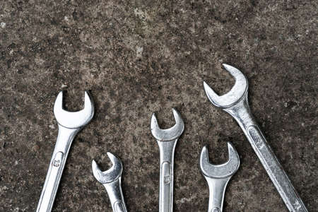 Wrenches on concrete background. Equipment. Engineering. High quality photo