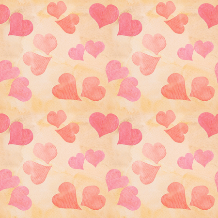 Seamless Valentine's day watercolor hearts background on paper textureの写真素材