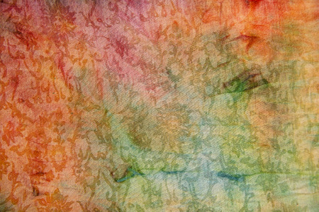 Colorful ethnic pattern fabric background texture close up