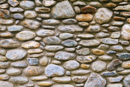 Old stone wall background texture close up