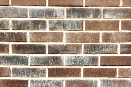 Dark brick wall background close up