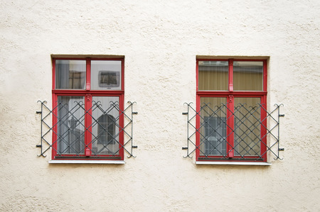 House wall with red windows in Riga Latviaの写真素材