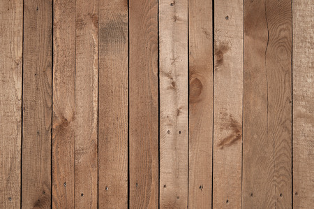 Old brown wooden fence background texture close upの写真素材