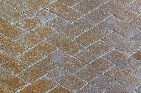 Old brown stone pavement background texture close upの写真素材