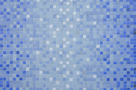 Blue and white mosaic wall background texture close up