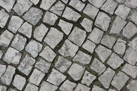 Old grey stone pavement background texture close upの写真素材