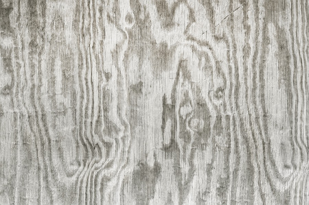 Old grey wooden fence background texture close up