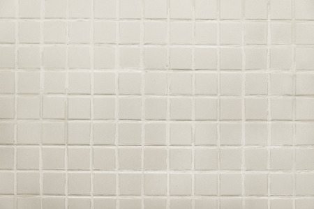 Old white tile wall background texture close upの写真素材
