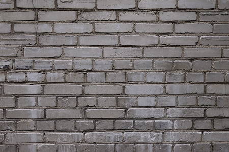Old grey stone wall background texture close upの写真素材