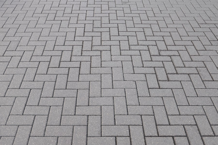 Old grey stone pavement background texture close upの写真素材