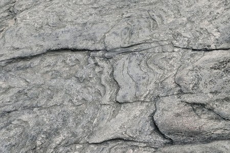 Grey granite rock background texture close up