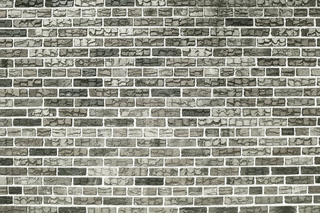 Old grey brick wall background texture close upの写真素材