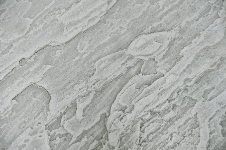 Old grey stone wall background texture close upの写真素材